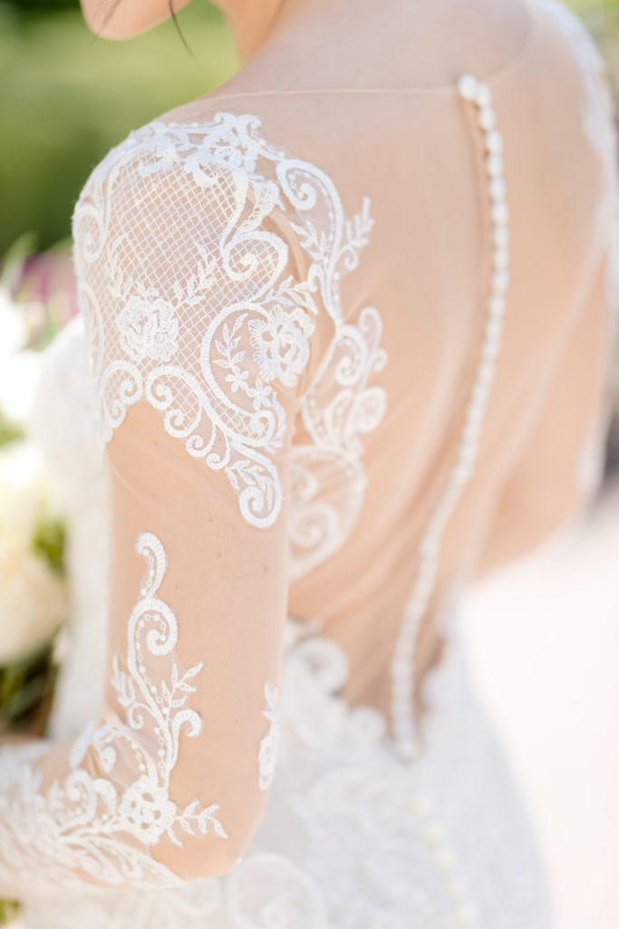 wedding dress sleeve details and button. Photo by Vanessa Joy Photography.