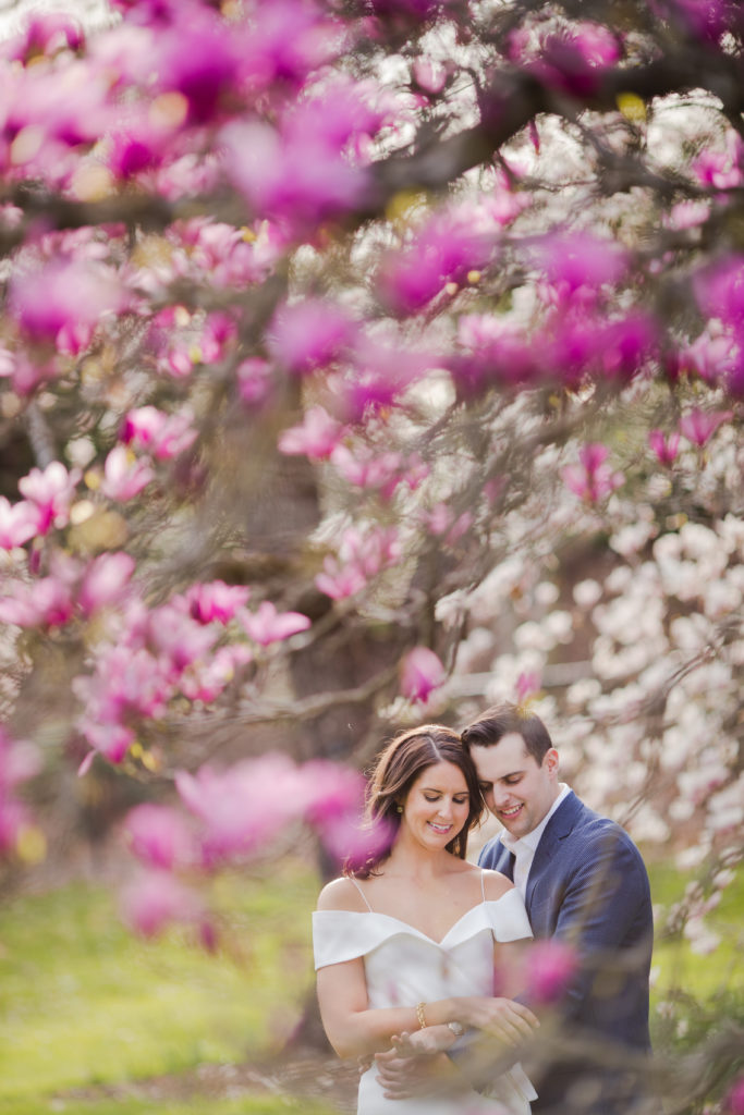 wedding engagement - garden pink flowers tree. Photo by Vanessa Joy Photography