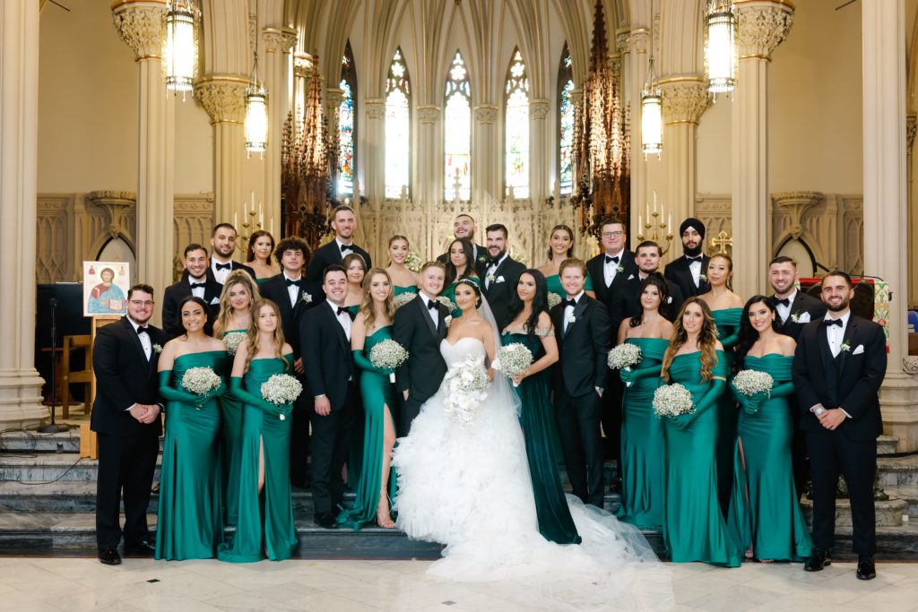 emerald green traditional bridal party photo at church