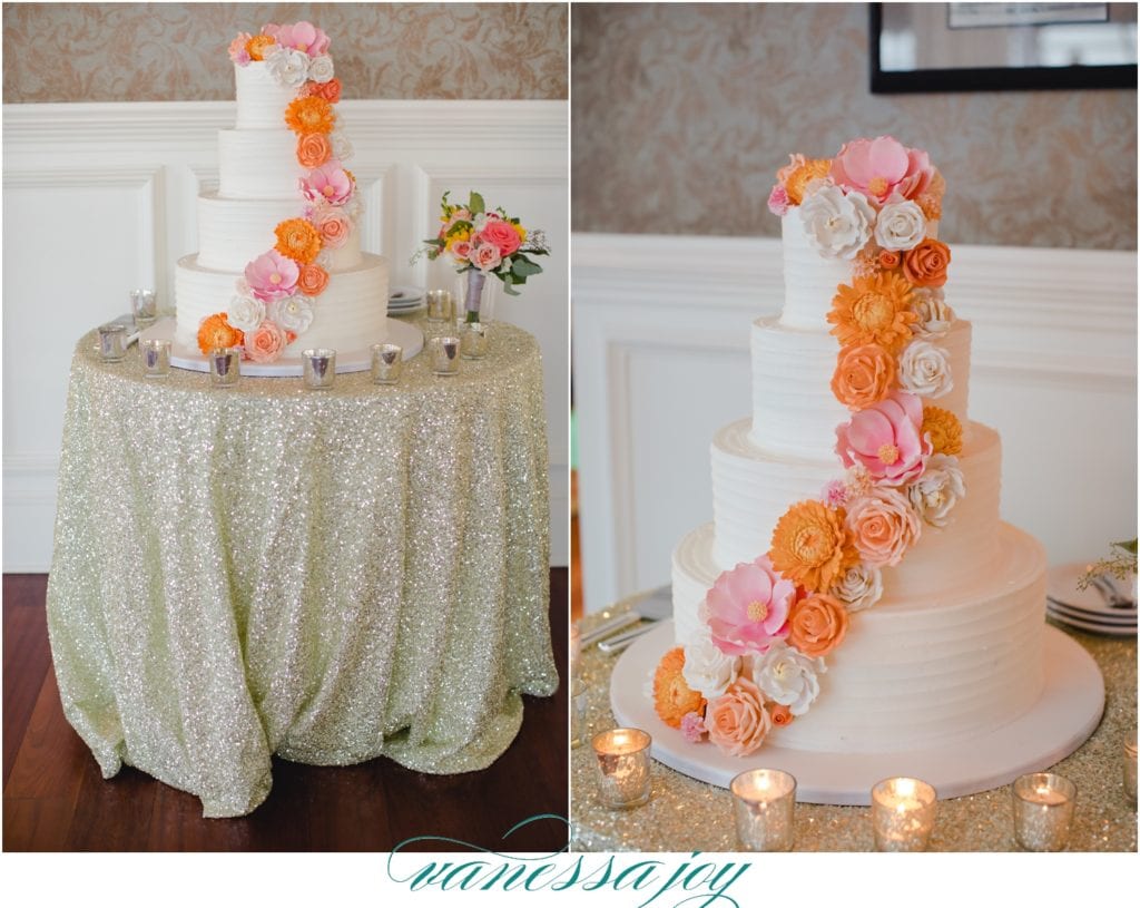 Orange Cascading Flowers on a cake, four tiered wedding cake ideas