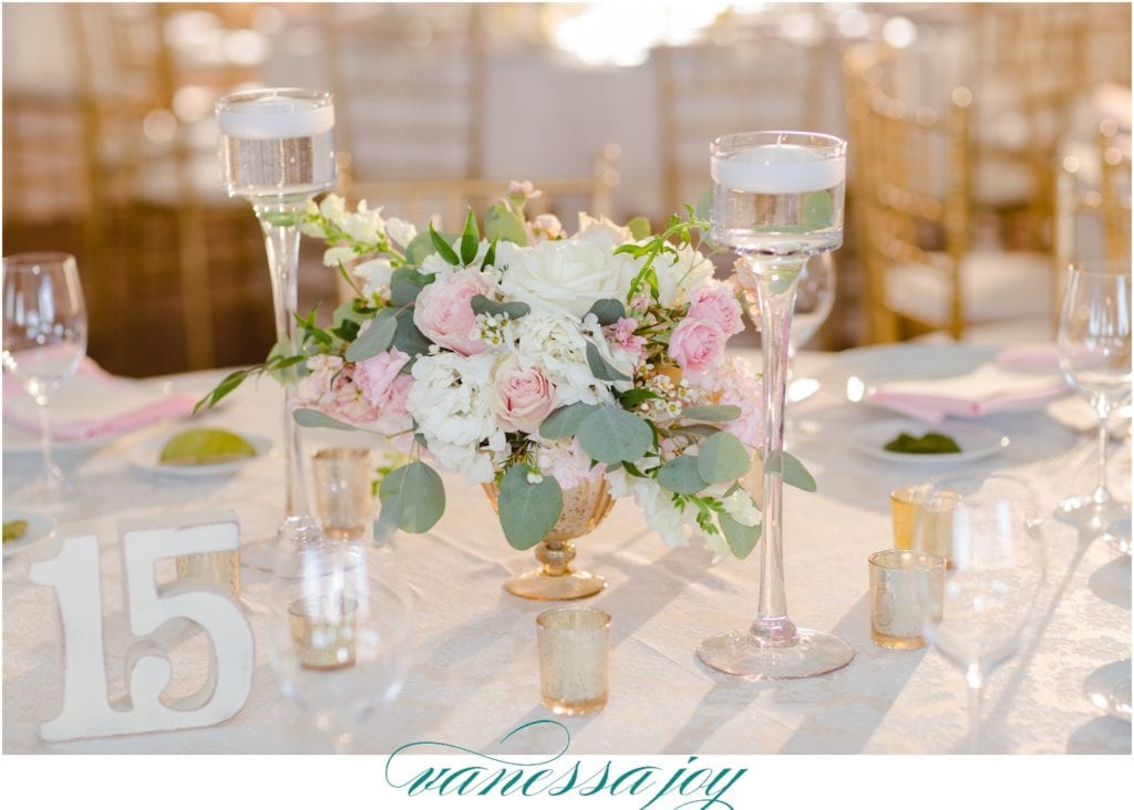 pink and white table flowers, hanging eucalyptus centerpieces