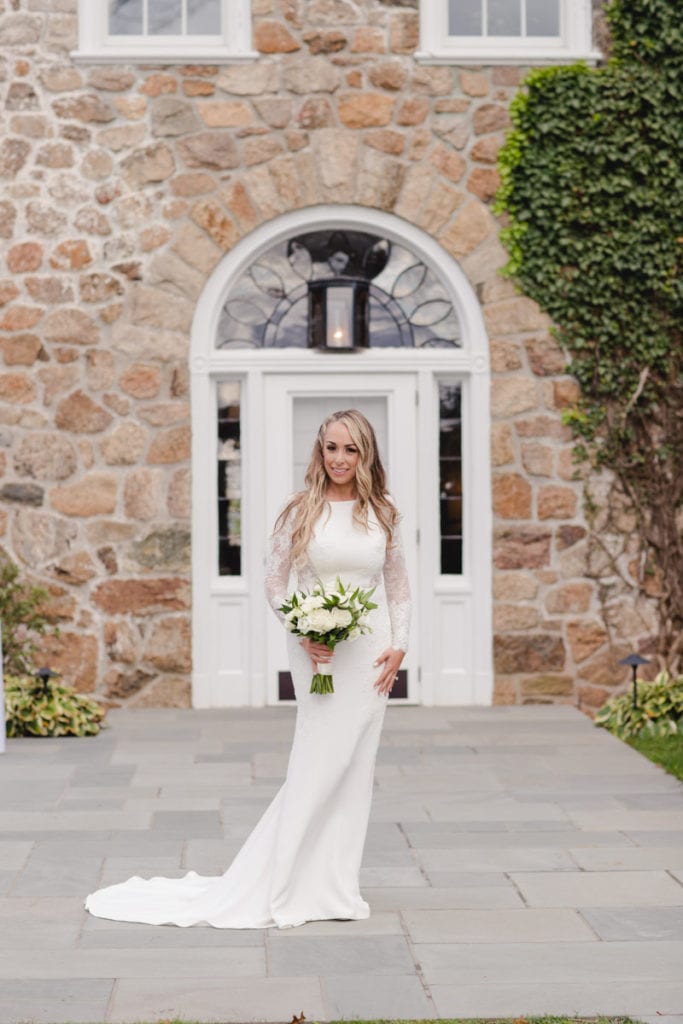 portrait of bride, chic and modern dress, all white bouquet