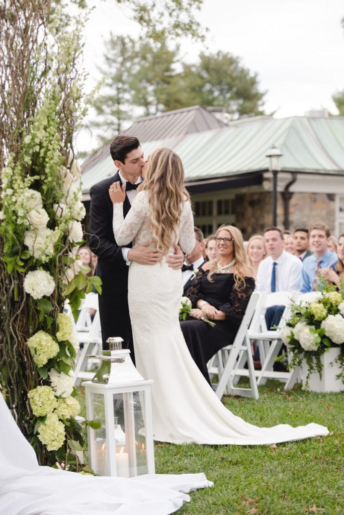 photo of first kiss, ceremony at fiddler's elbow country club, country club wedding