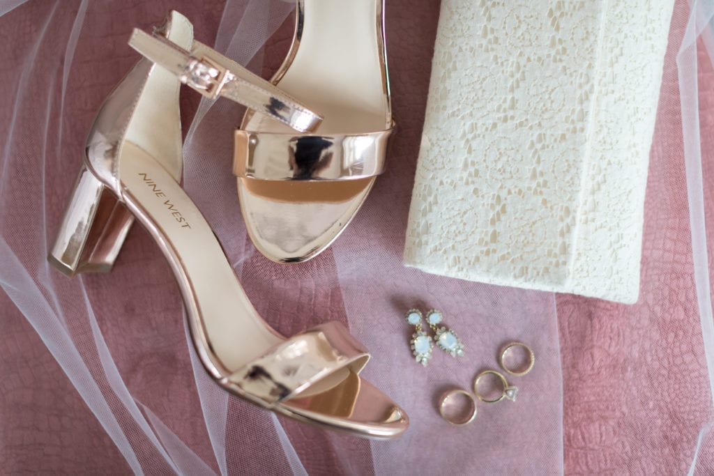 detail shot of Nine west wedding shoes, wedding rings and jewelry