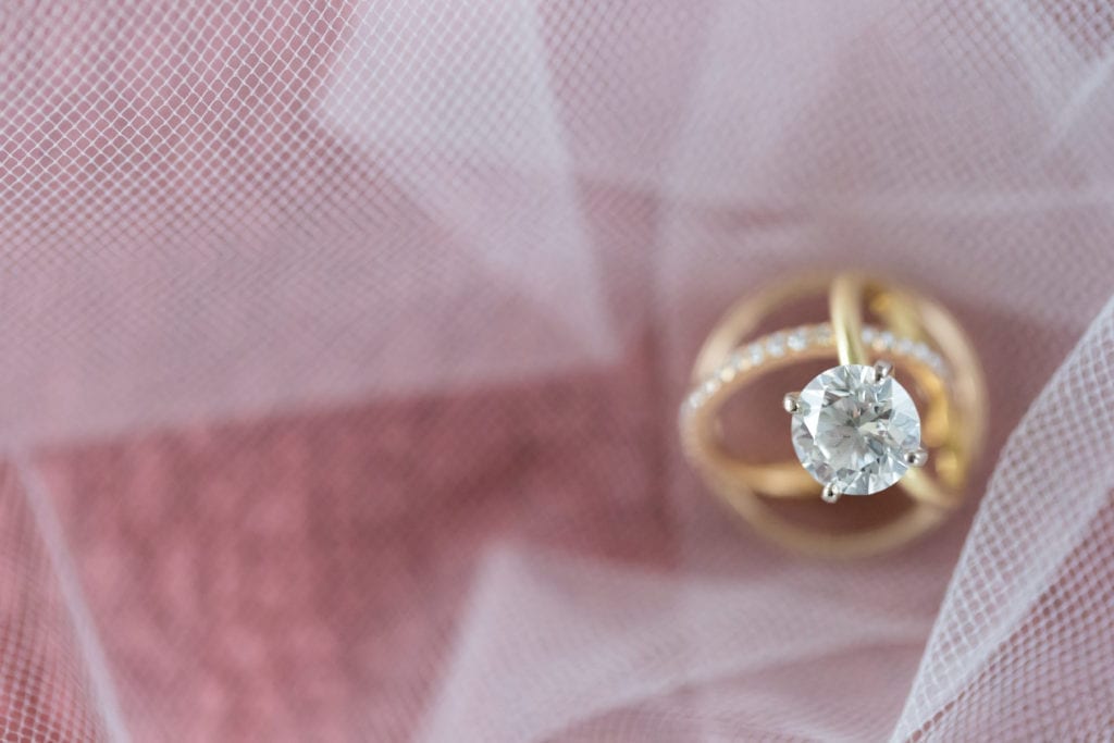 detail shot of round solitaire engagement ring