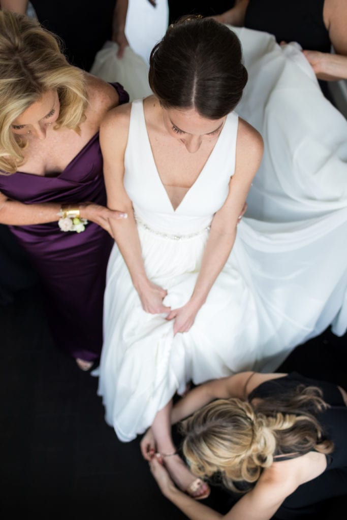 overhead shot of bride, mother of the bride and bridesmaids getting ready