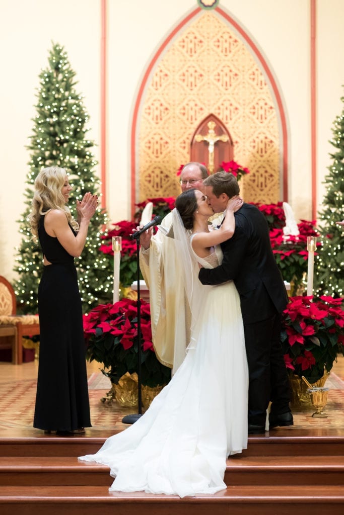 bride and grooms first kiss as husband and wife