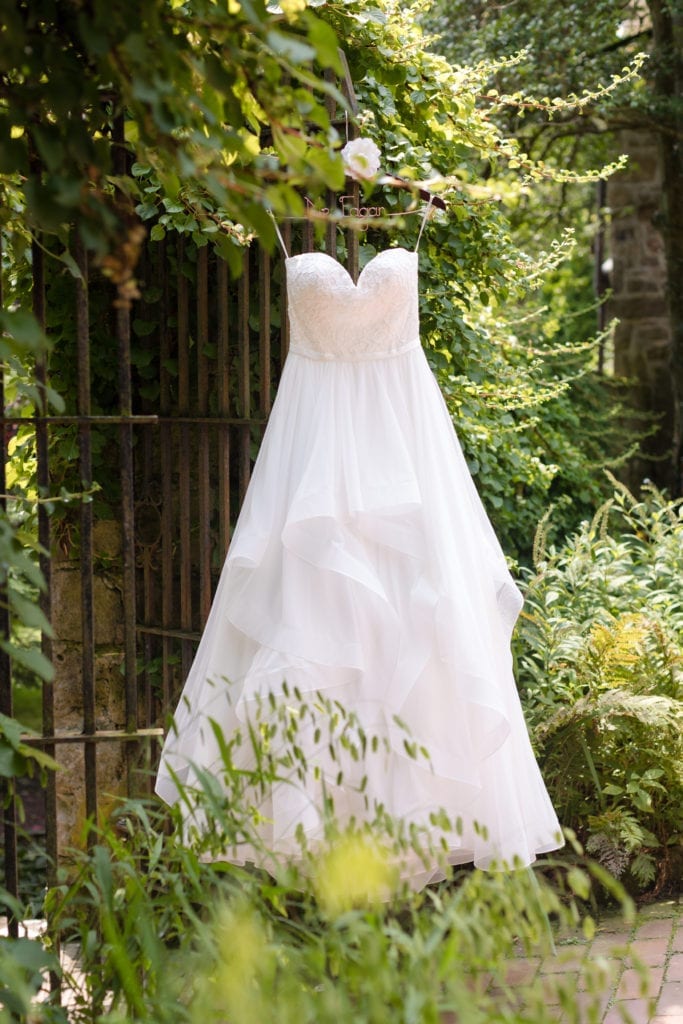 brides mikaella bridal gown hanging outside holly hedge estate