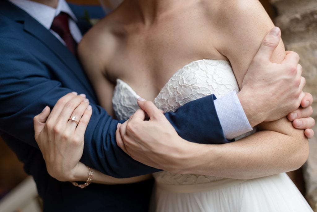 bride and groom interlocking arms