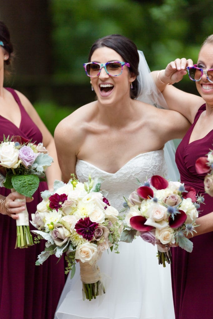bride in her colorful sunglasses