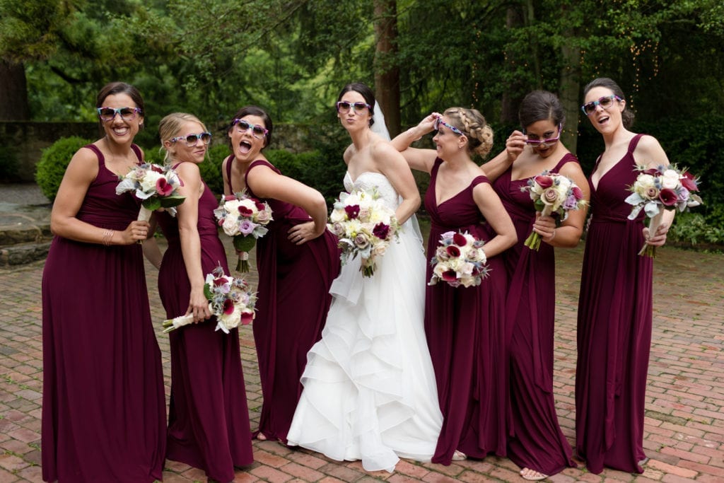bride and her bridal party making funny faces