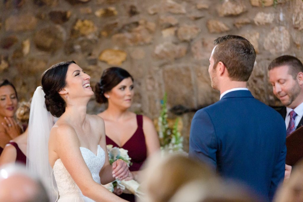 bride and groom laughing at their wedding ceremony