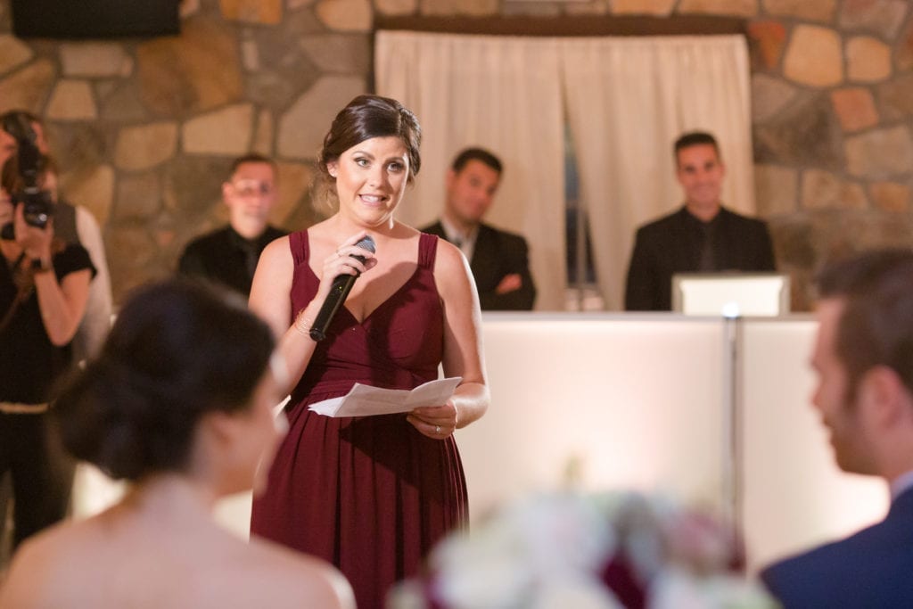 bridesmaid giving a speech at their wedding