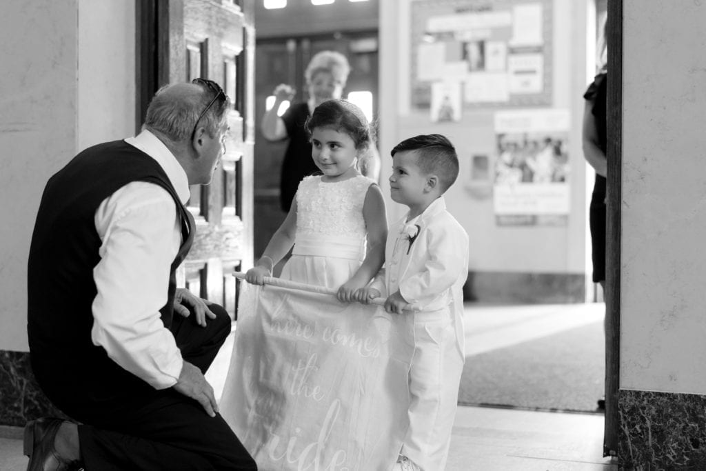 flower girl and ring bearer in a sweet black and white photo
