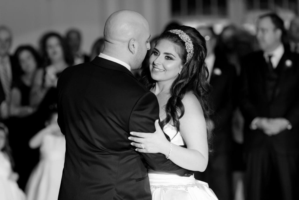 black and white photography of bride and grooms first dance