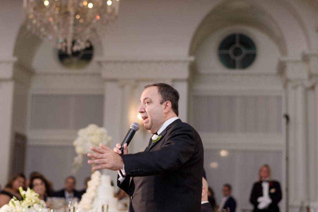 best man delivering his speech to bride and groom