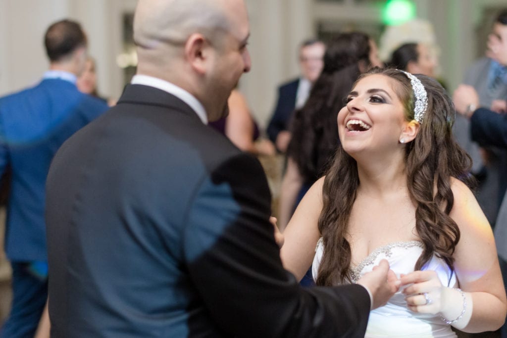 bride laughing with her groom