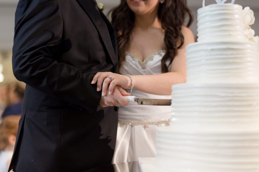 bride and groom cutting their Palermos bakery cake