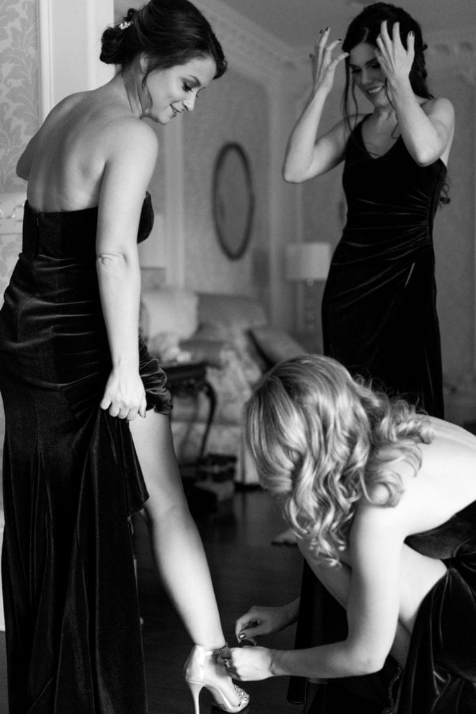 black and white photo of bridesmaids getting ready