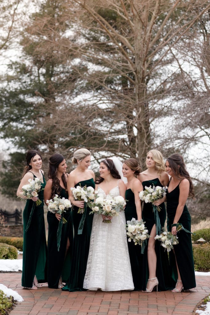 bridesmaids surrounding the bride