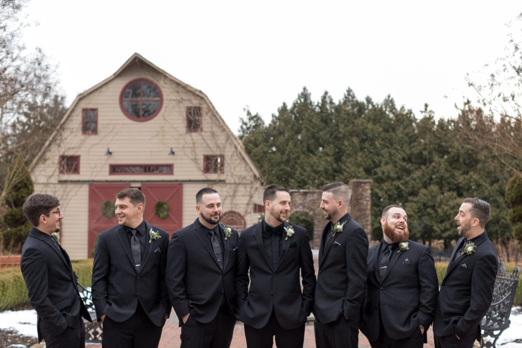 groom and his groomsmen posing for a picture