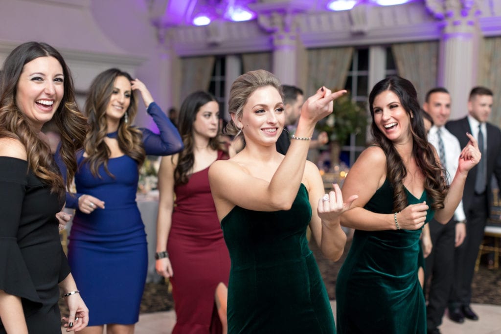 bridesmaids having fun at wedding reception