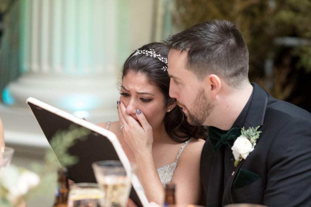 bride crying over a wedding gift