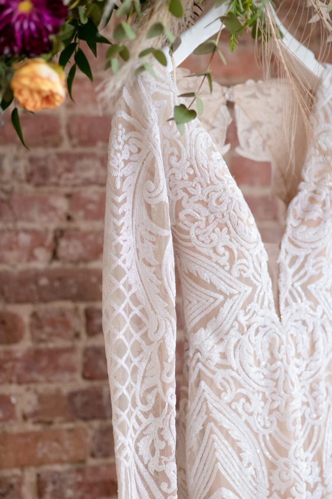 lace details of wedding dress, long sleeve deep plunge wedding dress