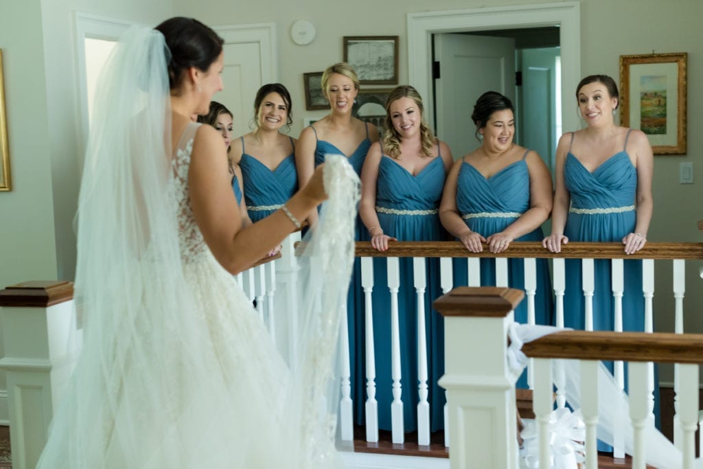 brides reveal to her bridesmaids