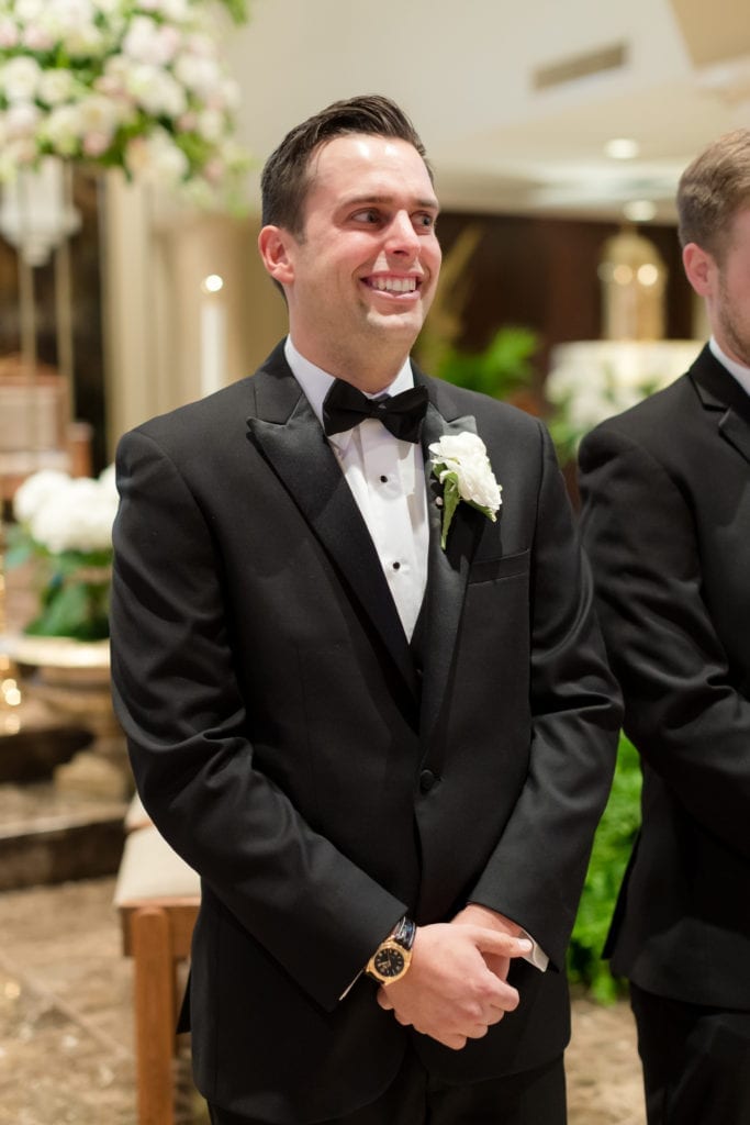 groom at alter awaiting his bride