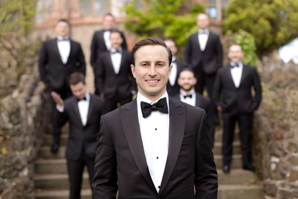 groom with groomsmen in the foreground