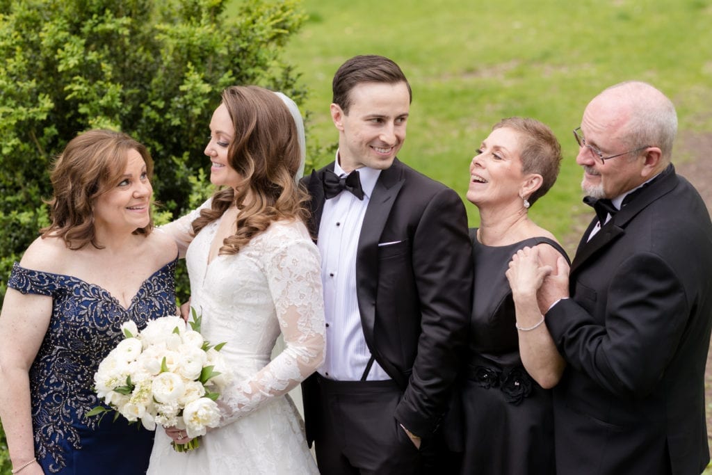 bride and groom with their family