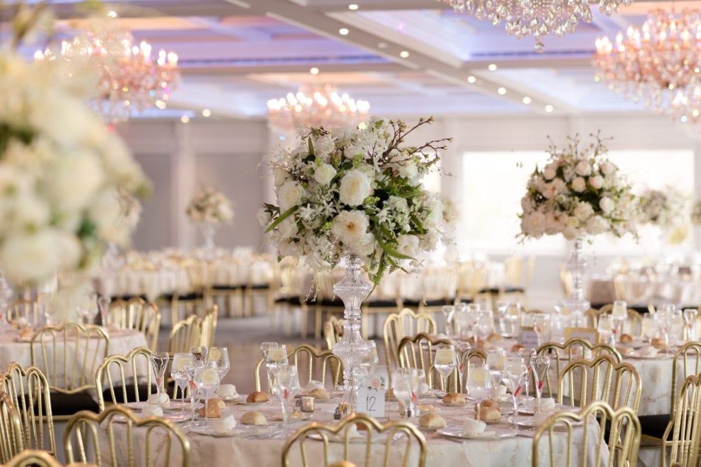 gold and white floral arrangements and wedding decor