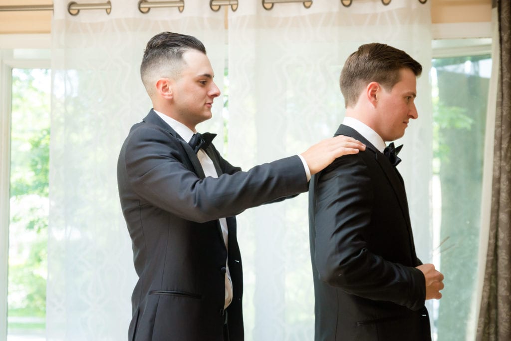 groom getting ready with his best man. groom and groomsman