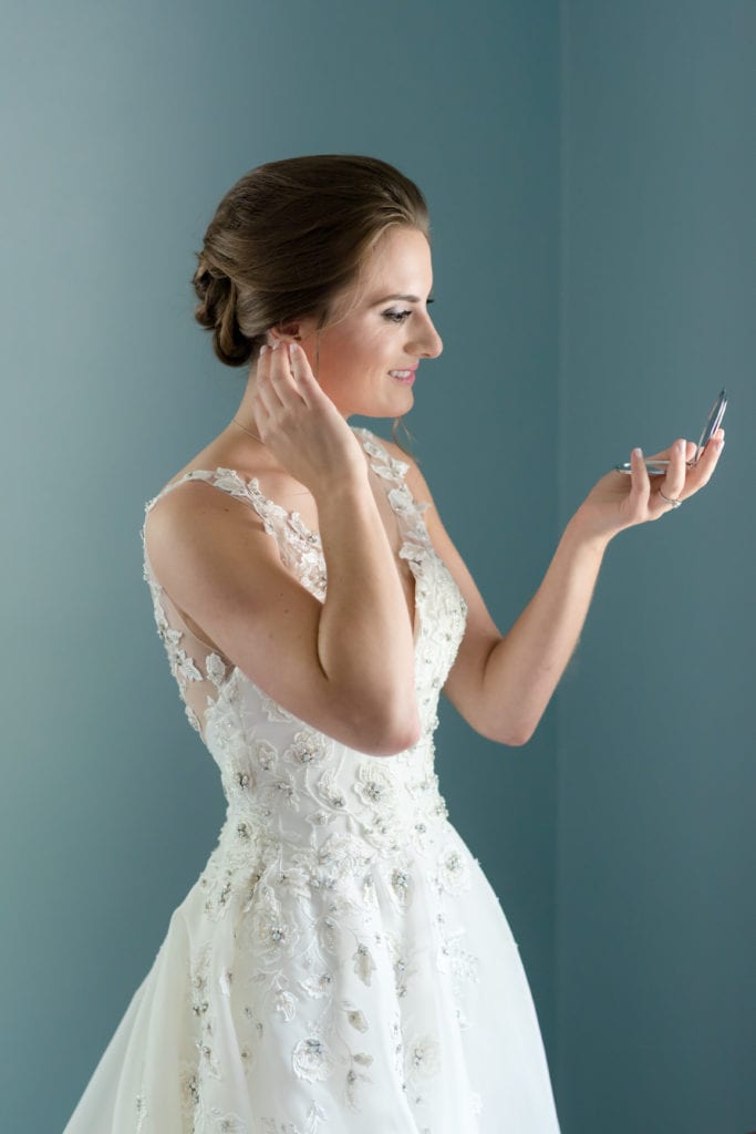 bride touching her makeup up