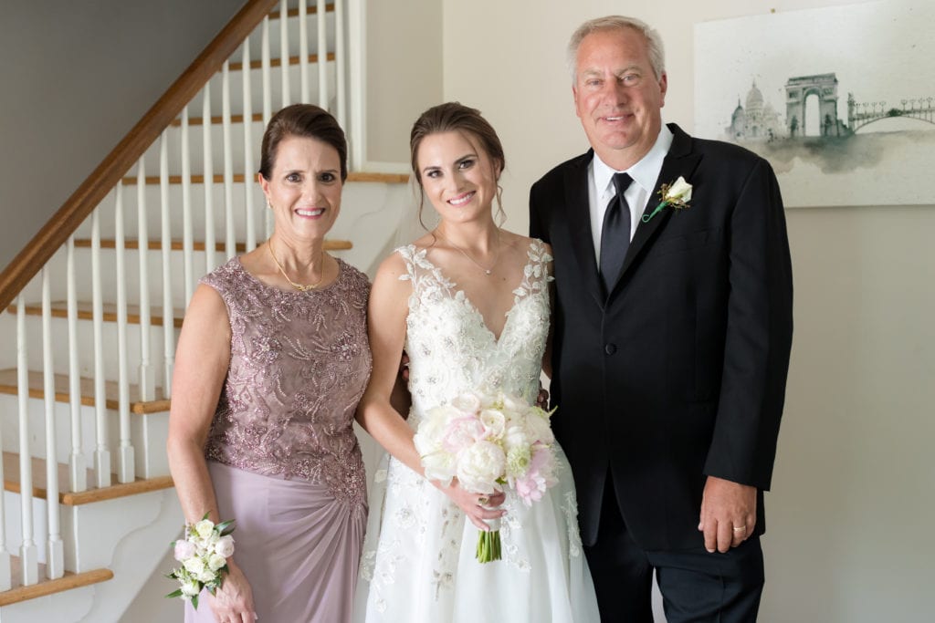 bride and her parents on wedding day