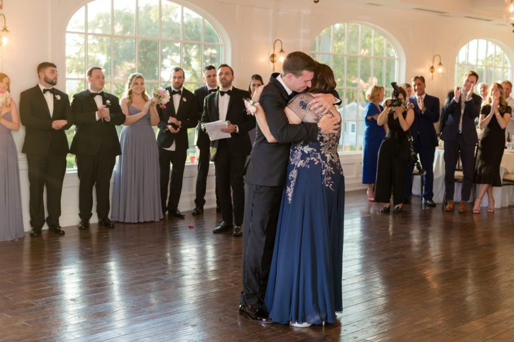 groom and his mother dancing at wedding reception