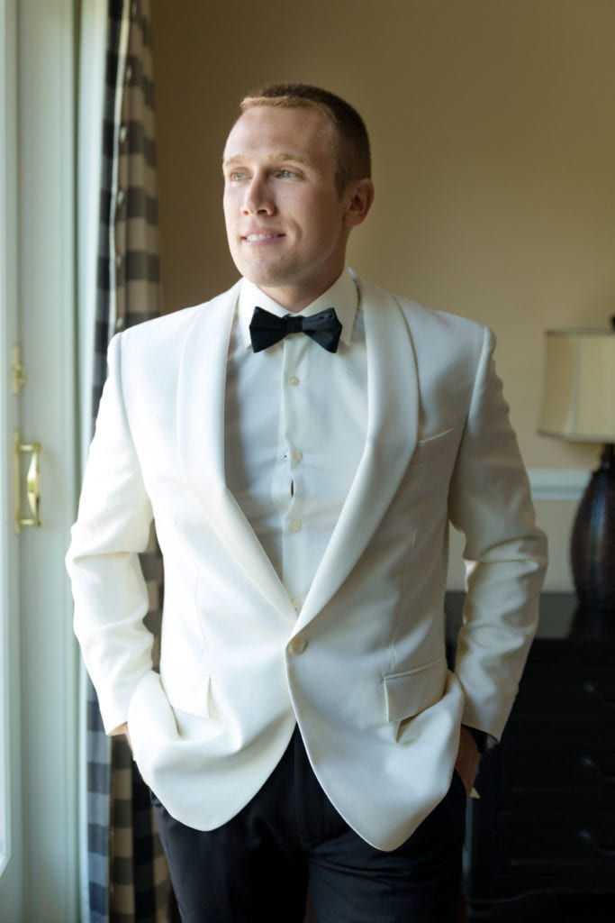 groom in suit on his wedding day