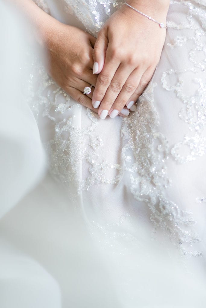 brides white manicure, brides round engagement ring