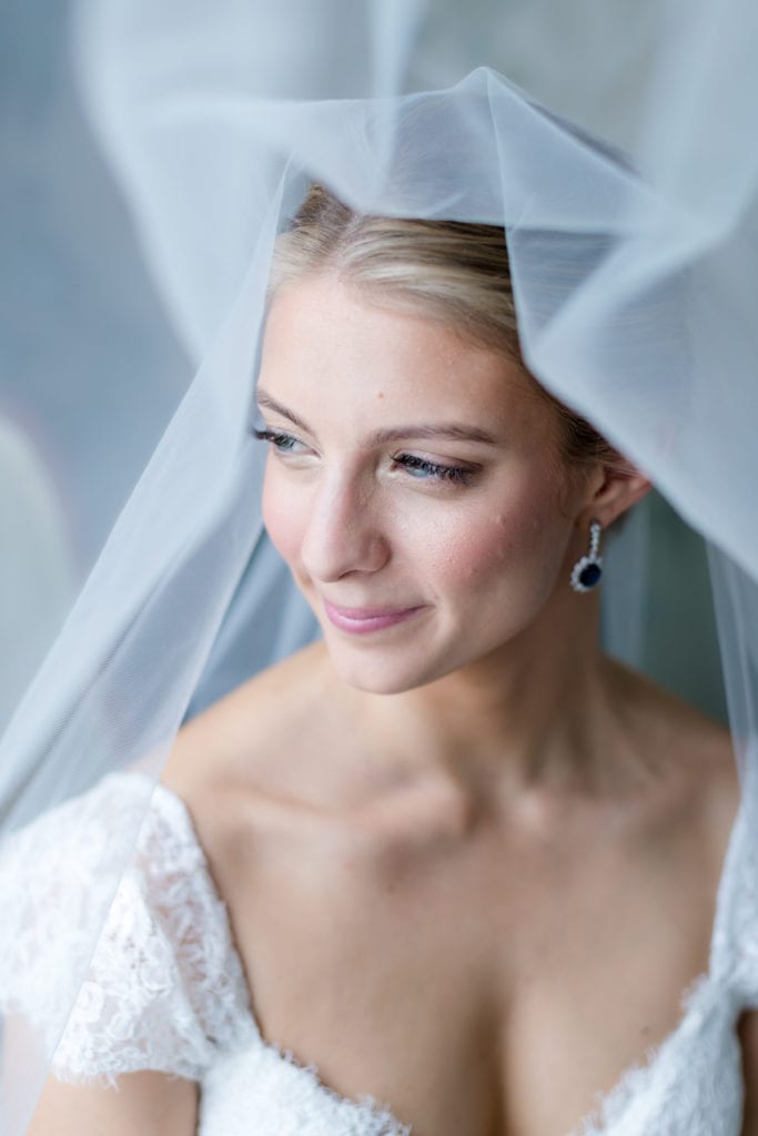 bride looking away with veil flowing