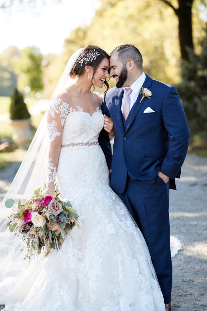 Pronovias floral sweetheart cut wedding gown, navy blue wedding suit