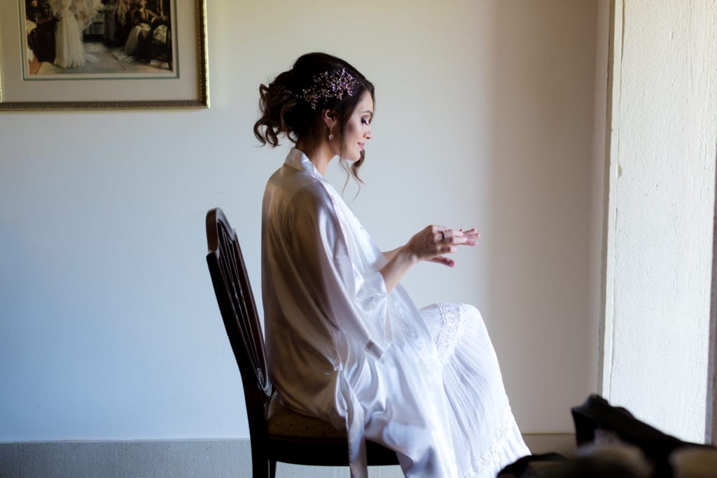 bride taking a moment to herself on wedding day