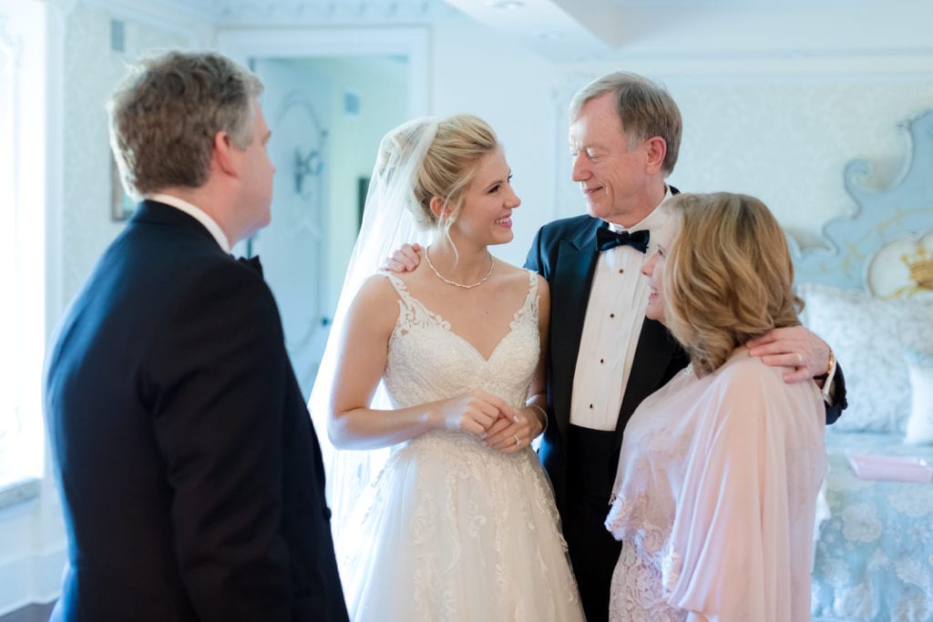 bride sharing a moment with her parents