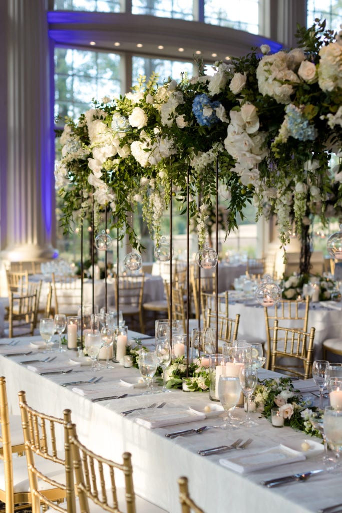 Tall white floral tablescapes, wedding decor with floating candles