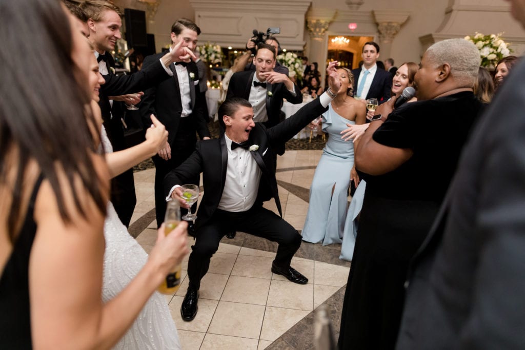 wedding guests dancing and having fun at reception