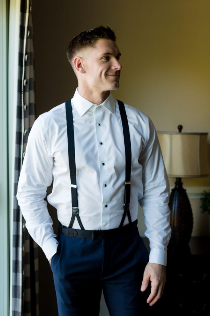 groom in suspenders from the Black Tux