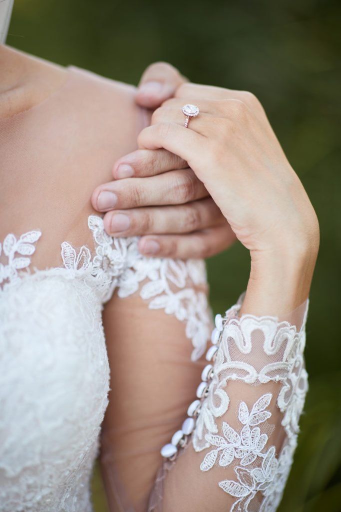 closeup bride and groom hands. Photo by Vanessa Joy Photography.