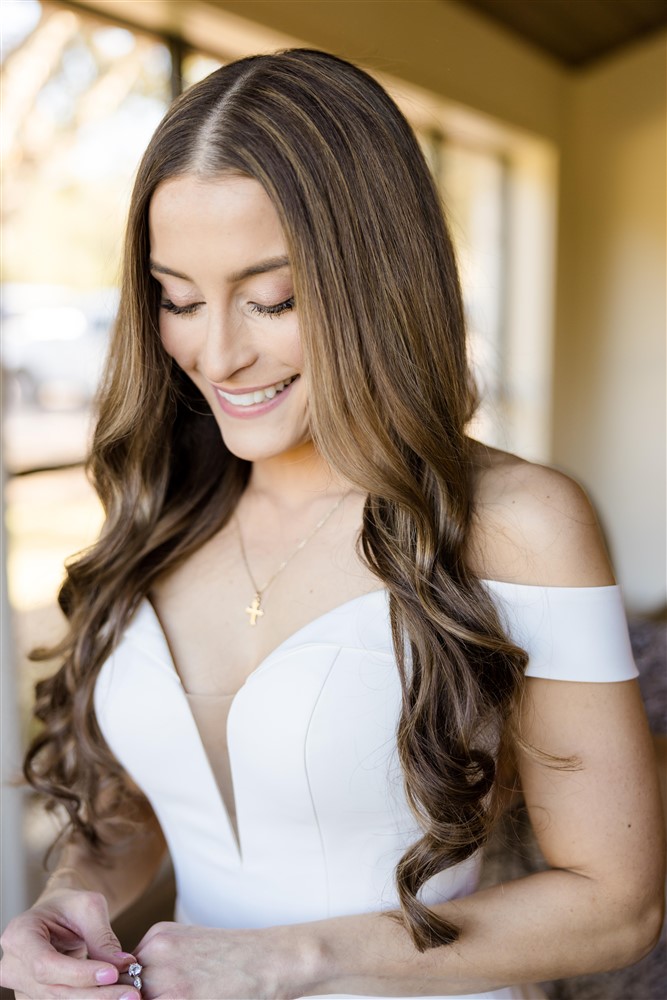 christian bride wearing cross necklace on wedding day. Photo by Vanessa Joy photography