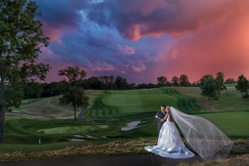 grand sunset sky of bride and groom in garden. Photo by Vanessa Joy Photography