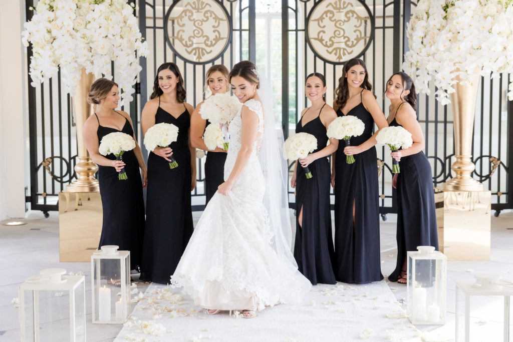 bride shows off her beautiful Maggie Sottero Designs wedding gown